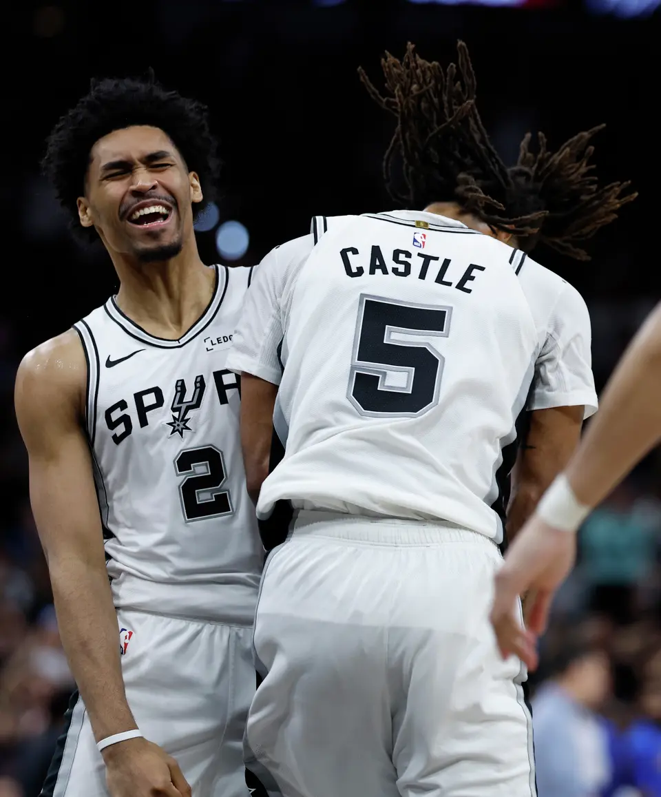San Antonio Spurs guard Dylan Harper (2) and San Antonio Spurs guard Stephon Castle (5) celebrate as the Spurs begin to pull away from the Thunder during the third quarter of Game 4 of the Western Conference Finals at Frost Bank Center in San Antonio, Sunday, May 24, 2026.