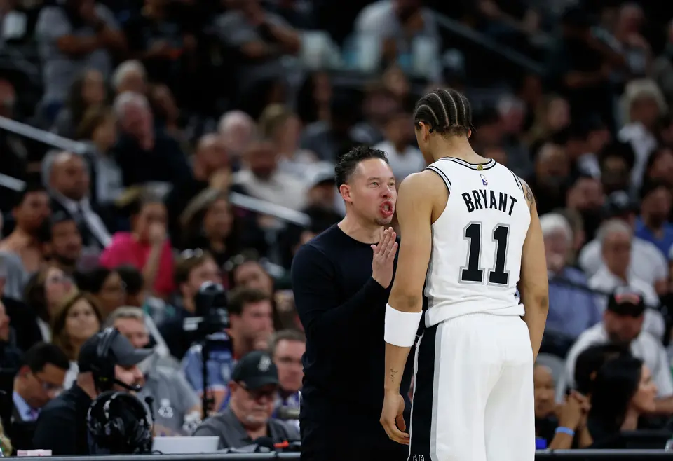 San Antonio Spurs head coach Mitch Johnson gave rookie Carter Bryant a tongue lashing  after he committed a turnover in the third quarter of Game 4 of the Western Conference Finals at Frost Bank Center in San Antonio, Sunday, May 24, 2026.