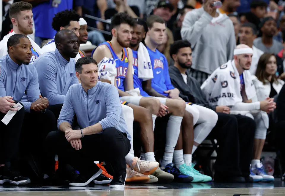 A solemn-looking Oklahoma City Thunder bench watches San Antonio run away with the game during the fourth quarter of Game 4 of the Western Conference Finals at Frost Bank Center in San Antonio, Sunday, May 24, 2026. The Spurs defeated the Thunder 103-82 to even up the series 2-2.