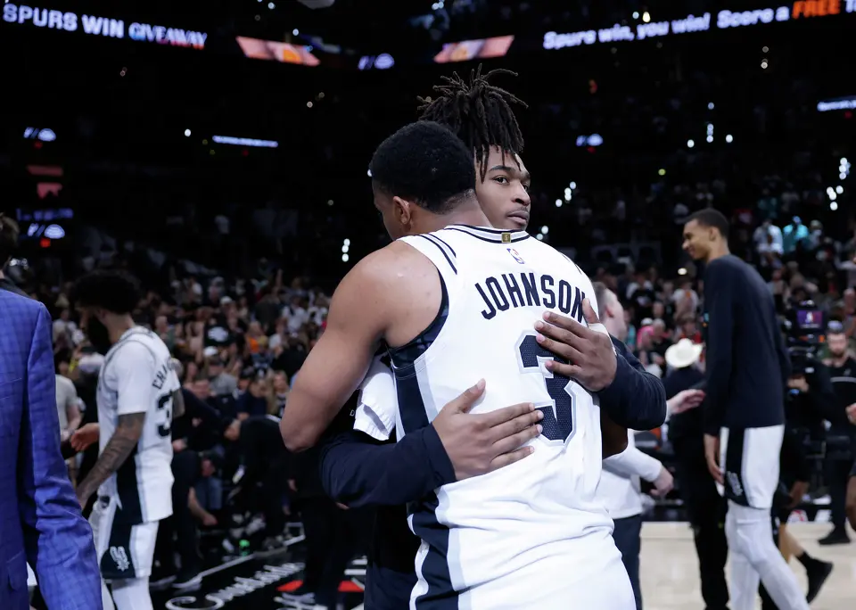 San Antonio Spurs forward Keldon Johnson (3) and San Antonio Spurs guard Stephon Castle (5) hug at the end of Game 4 of the Western Conference Finals at Frost Bank Center in San Antonio, Sunday, May 24, 2026. The Spurs defeated the Thunder 103-82 to even up the series 2-2.