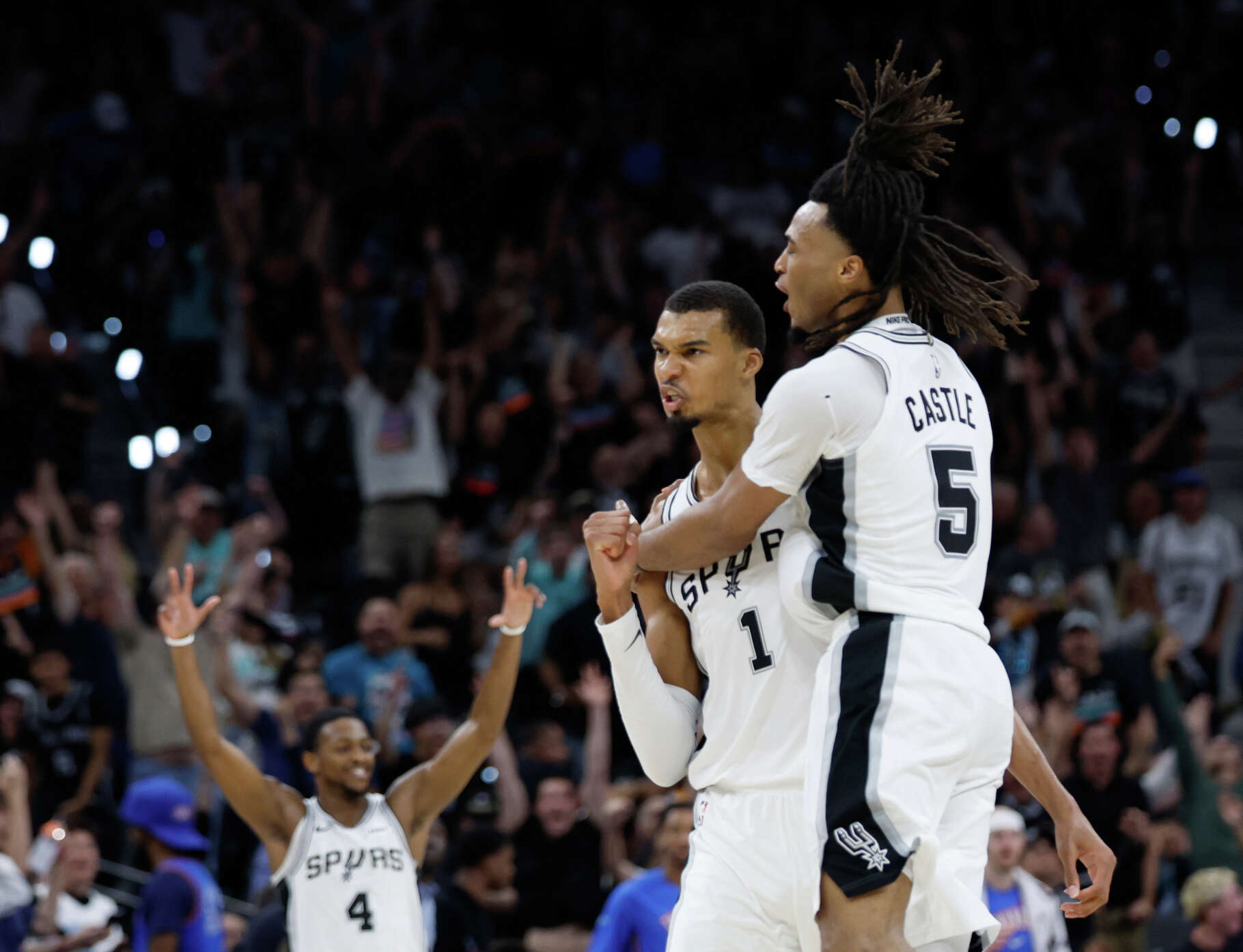 San Antonio Spurs forward Victor Wembanyama (1) and San Antonio Spurs guard Stephon Castle (5) celebrate Wembanyama’s three point shot at the buzzer to end the second quarter of Game 4 of the Western Conference Finals at Frost Bank Center in San Antonio, Sunday, May 24, 2026.