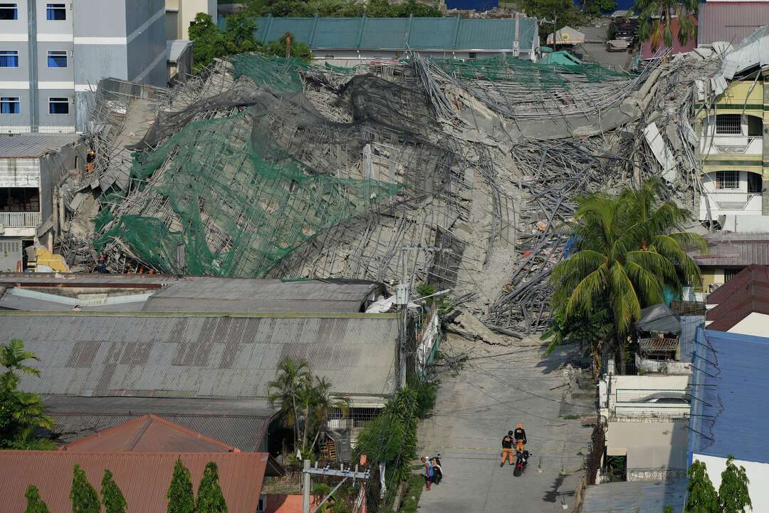 Photos show the aftermath of a building collapse in the Philippines