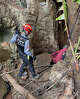 In this release Metta Tham Rescue Kalasin, rescuers work to reach seven people who have been trapped in a cave in Xaisomboun province, Laos, Monday, May 25, 2026. (Metta Tham Rescue Kalasin via AP)