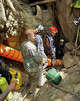 In this release Metta Tham Rescue Kalasin, rescuers work to reach seven people who have been trapped in a cave in Xaisomboun province, Laos, Monday, May 25, 2026. (Metta Tham Rescue Kalasin via AP)