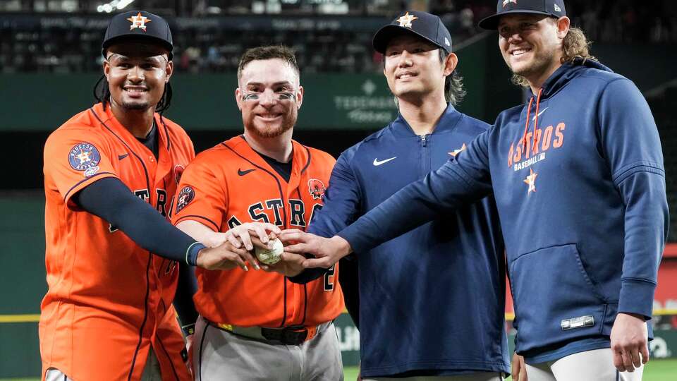 Houston Astros pitcher Alimber Santa (from left), catcher Christian Vázquez, pitcher Tatsuya Imai and pitcher Steven Okert pose for a photo after a combined no-hitter against the Texas Rangers at Globe Life Field on Monday, May 25, 2026, in Arlington.