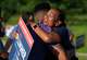 Congressman Christian Menefee, left, and Letitia Plummer greet each with a hug outside the Sunnyside Multi-Service Center during the primary runoff election in Houston Tuesday, May 26, 2026.