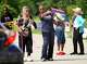 Letitia Plummer, second from left, points to entrance for a voter as she and Annise Parker, right, both campaign for Harris County Judge outside the Sunnyside Multi-Service Center during the primary runoff election in Houston Tuesday, May 26, 2026.