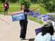Letitia Plummer campaigns for Harris County Judge outside the Sunnyside Multi-Service Center during the primary runoff election in Houston Tuesday, May 26, 2026.