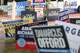 Signs are displayed outside of a voting center during primary election runoff day at Oak Lawn Library on Tuesday, May 26, 2026 in Dallas.