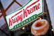 Krispy Kreme store logo and window on in London, United Kingdom.