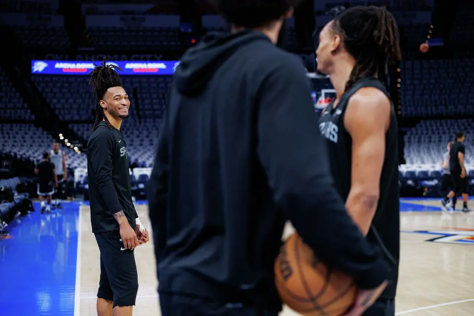 San Antonio Spurs’ Stephon Castle, from left, laughs while talking to his teammates Julian Champagnie and Devin Vassell during shootaround at Paycom Center in Oklahoma City, Tuesday, May 26, 2026, as they prepare for Game 5 of the Western Conference Finals against the Oklahoma City Thunder.