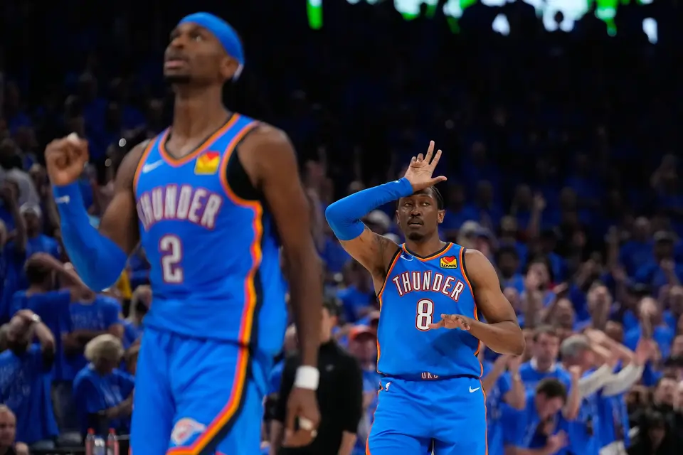 Oklahoma City Thunder guard Jalen Williams (8) and guard Shai Gilgeous-Alexander (2) celebrate after a 3-pointer during the second overtime of Game 1 in a third-round NBA basketball playoffs series against the San Antonio Spurs Monday, May 18, 2026, in Oklahoma City.