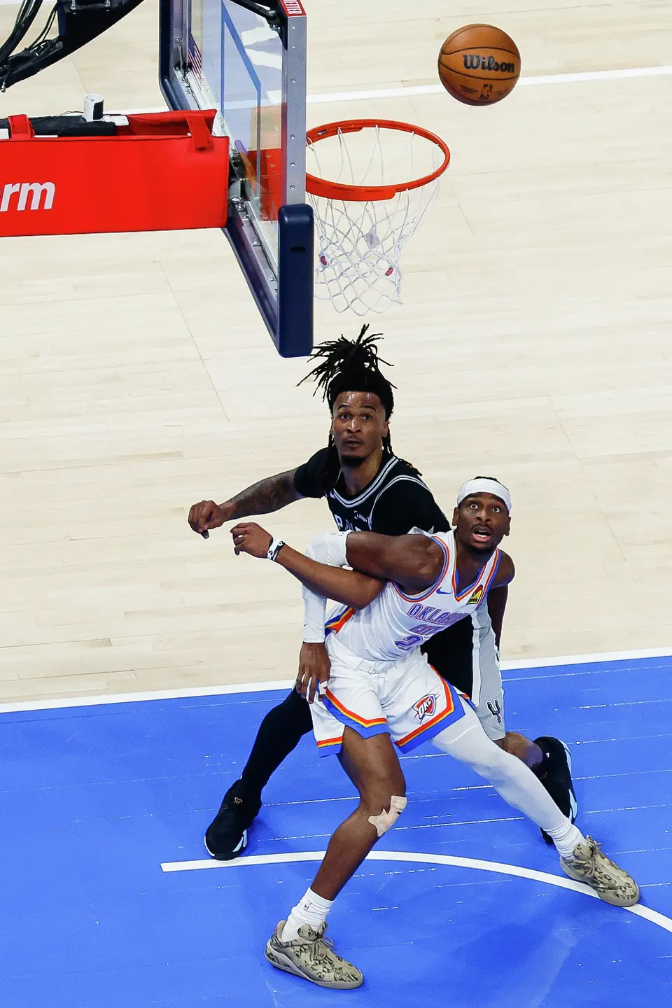 San Antonio Spurs guard Stephon Castle (5) and Oklahoma City Thunder guard Shai Gilgeous-Alexander (2) watch the ball during the first quarter of Game 5 of the Western Conference Finals at Paycom Center in Oklahoma City, Tuesday, May 26, 2026.
