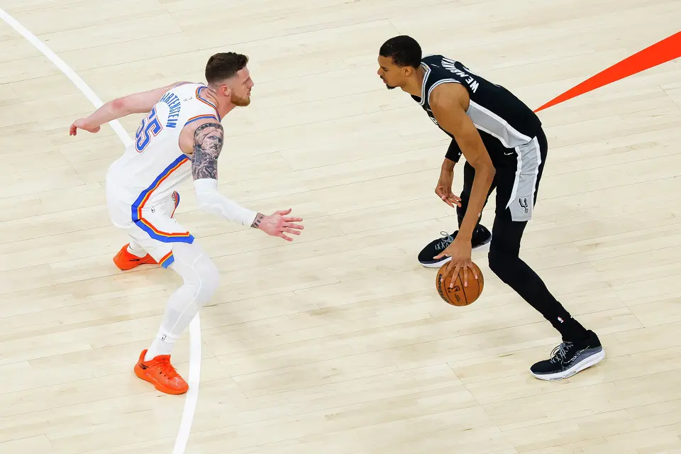 San Antonio Spurs center Victor Wembanyama (1) dribbles the ball while guarded by Oklahoma City Thunder center Isaiah Hartenstein (55) during the first quarter of Game 5 of the Western Conference Finals at Paycom Center in Oklahoma City, Tuesday, May 26, 2026.