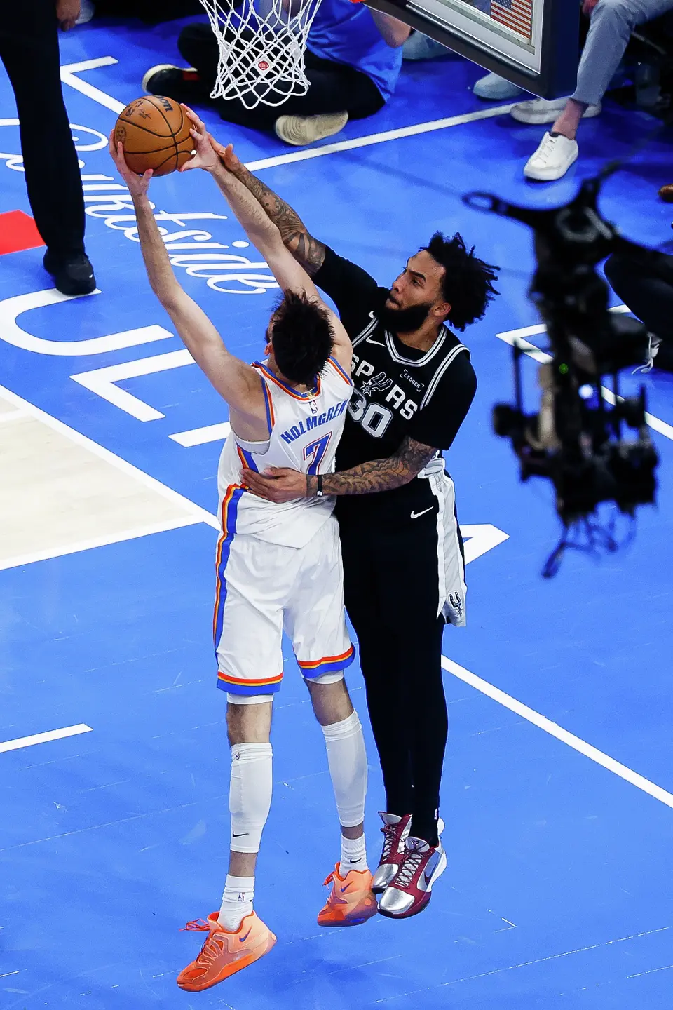 San Antonio Spurs forward Julian Champagnie (30) goes up to block a shot by Oklahoma City Thunder center Chet Holmgren (7) during the second quarter of Game 5 of the Western Conference Finals at Paycom Center in Oklahoma City, Tuesday, May 26, 2026.