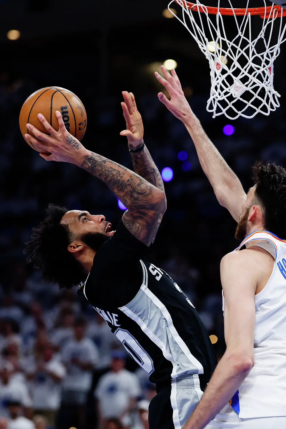 San Antonio Spurs forward Julian Champagnie (30) goes up for a shot during the third quarter of Game 5 of the Western Conference Finals at Paycom Center in Oklahoma City, Tuesday, May 26, 2026.