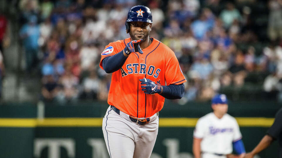 Houston Astros' Yordan Alvarez reacts to hitting a three run home run during the third inning of a baseball game against the Texas Rangers, Tuesday, May 26, 2026, Arlington, Texas. (AP Photo/Jessica Tobias)
