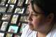 Adriana Garzon, mother of Brayan Rayo Garzon who died by suicide while in ICE custody in April 2025, sits in front of a collection of family photos in St. Louis, Friday, May 1, 2026.
