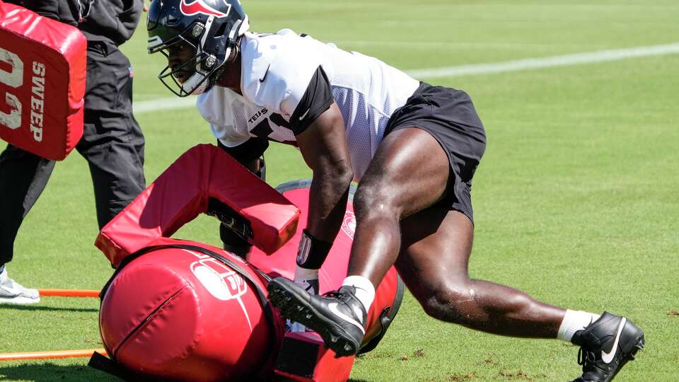 Houston Texans defensive end Will Anderson Jr. (51) hits a tackling dummy during OTAs at Houston Methodist Training Center in Houston, Thursday, May 28, 2026.