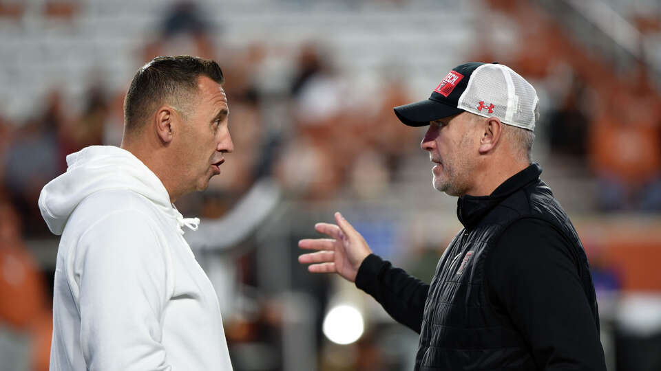 Texas Tech's Joey McGuire (right) had a response for UT's Steve Sarkisian, and the Red Raiders' coach threw down a challenge to play in Week 1 next season.