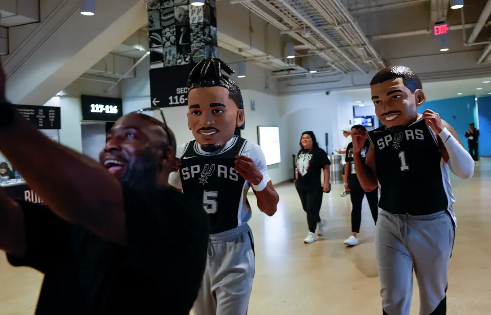 Fans dressed as San Antonio Spurs guard Stephon Castle (5)and San Antonio Spurs center Victor Wembanyama (1) walk around before Game 6 of the Western Conference Finals at Frost Bank Center in San Antonio, Thursday, May 28, 2026.