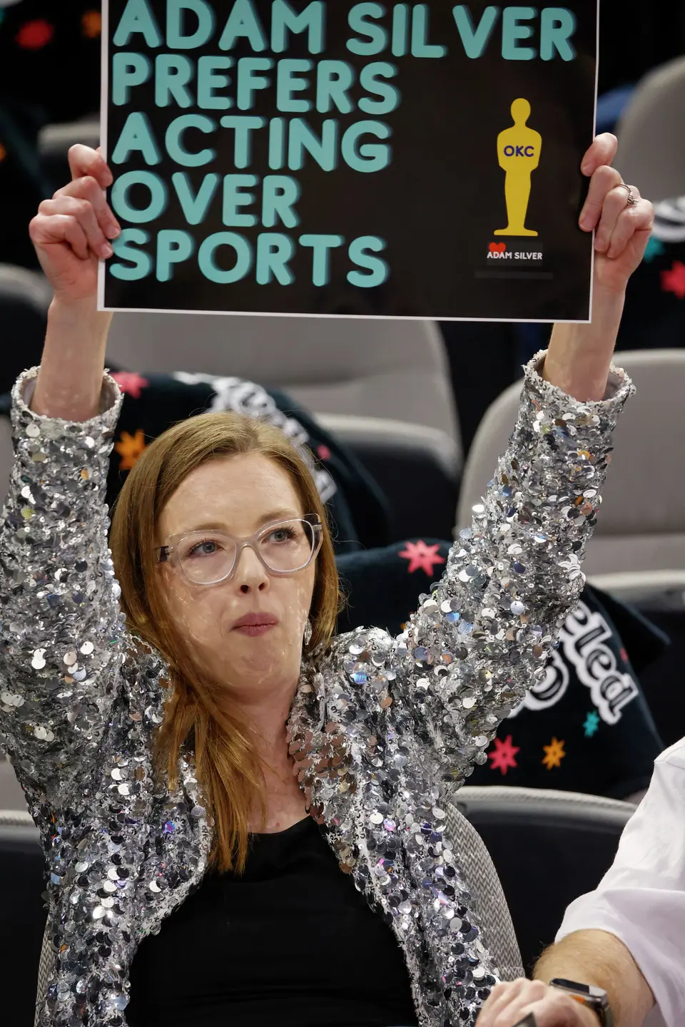 Alyssa Pierce holds up a sign before Game 6 of the Western Conference Finals at Frost Bank Center in San Antonio, Thursday, May 28, 2026.