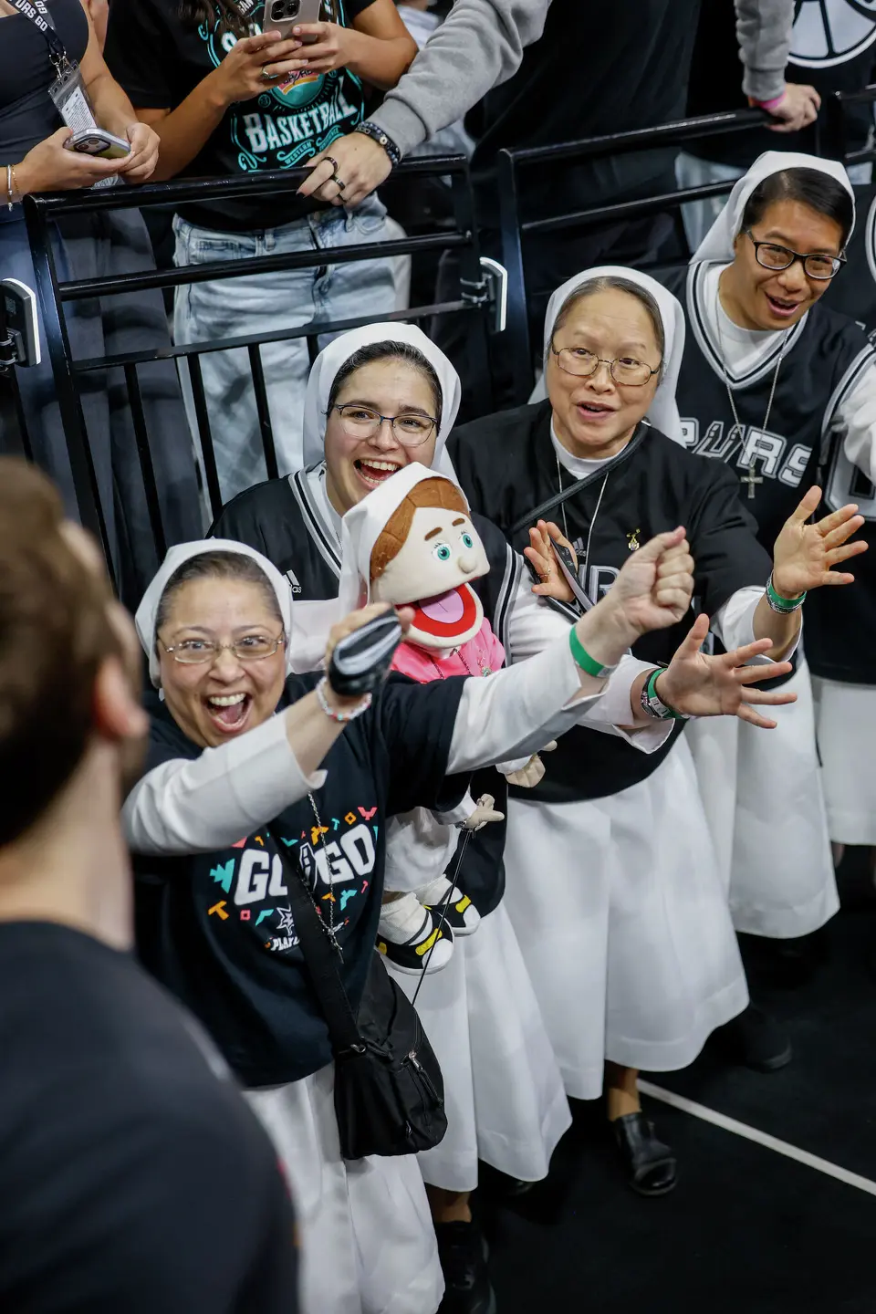 Salesian Sisters of St. John Bosco watch the San Antonio Spurs warm up before Game 6 of the Western Conference Finals at Frost Bank Center in San Antonio, Thursday, May 28, 2026.