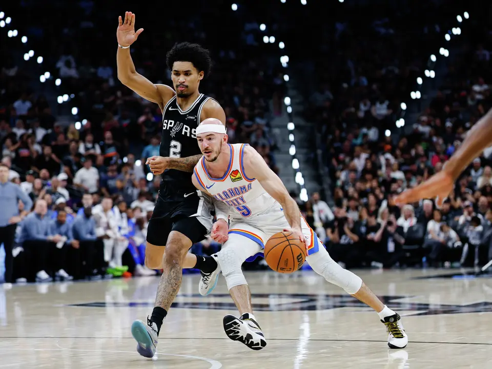 Oklahoma City Thunder guard Alex Caruso (9) dribbles by San Antonio Spurs guard Dylan Harper (2) during Game 6 of the Western Conference Finals at Frost Bank Center in San Antonio, Thursday, May 28, 2026.