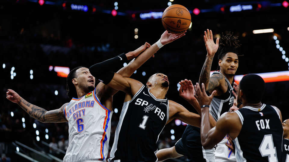 Oklahoma City Thunder forward Jaylin Williams (6) reaches for the ball around San Antonio Spurs center Victor Wembanyama (1) during Game 6 of the Western Conference Finals at Frost Bank Center in San Antonio, Thursday, May 28, 2026.