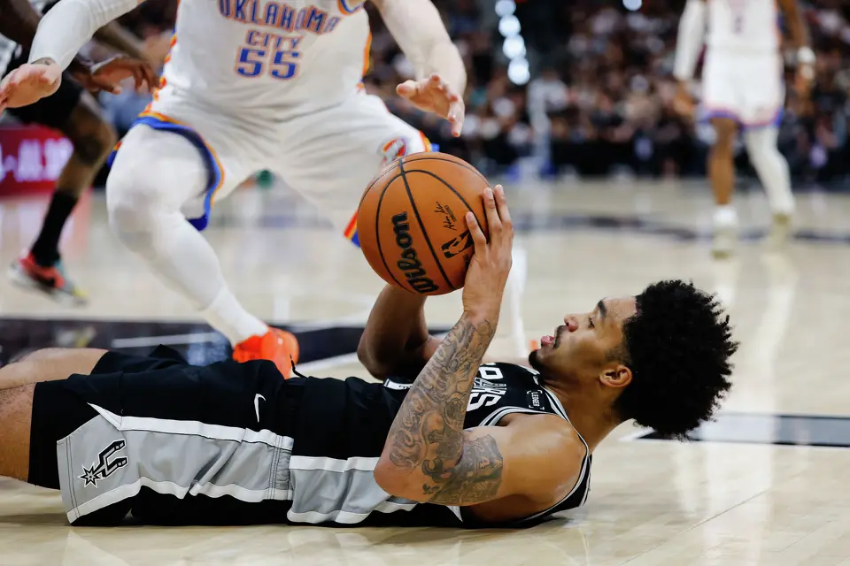 San Antonio Spurs guard Dylan Harper (2) falls to the ground during Game 6 of the Western Conference Finals at Frost Bank Center in San Antonio, Thursday, May 28, 2026.