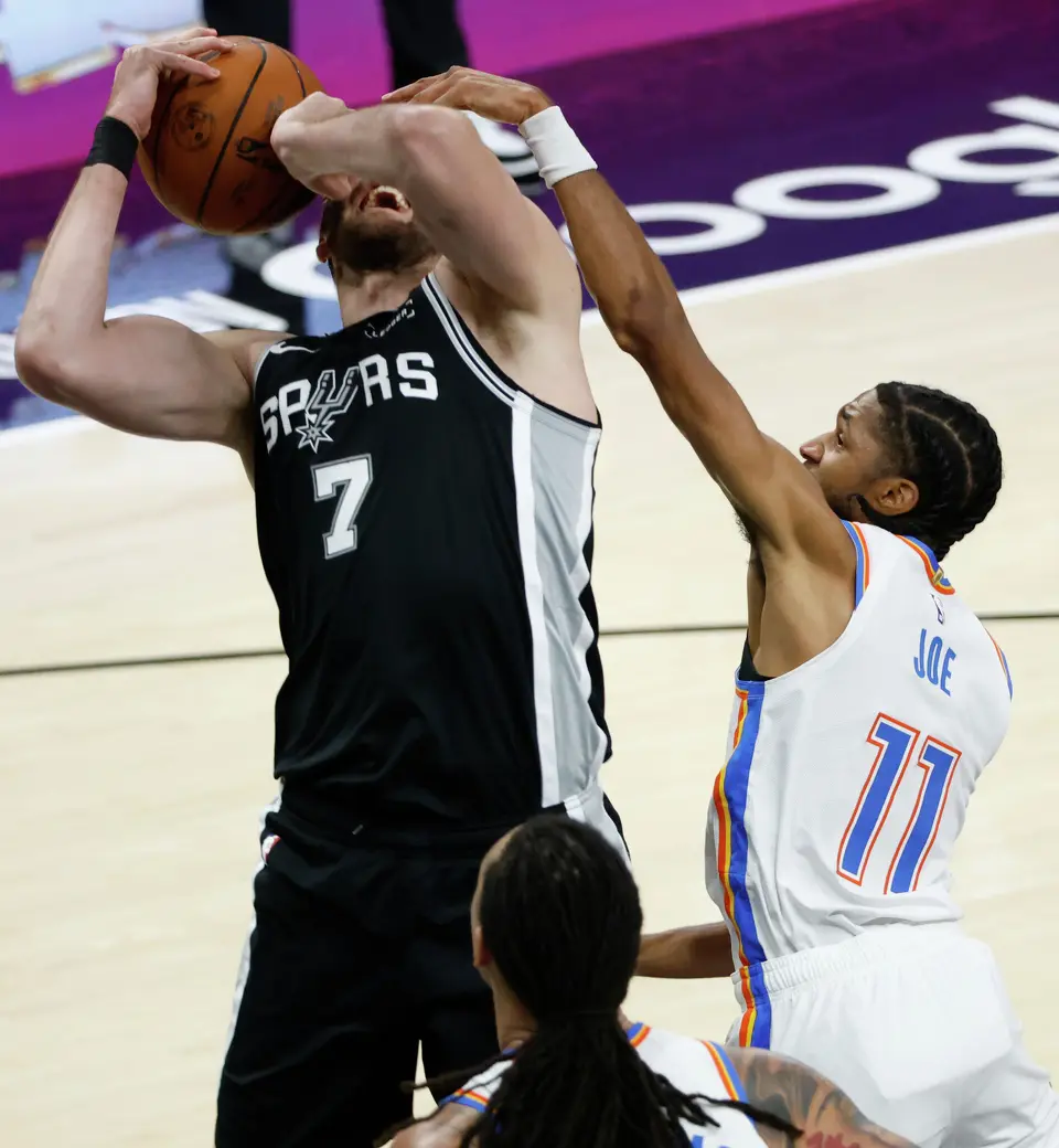 San Antonio Spurs center Luke Kornet (7) reacts while Oklahoma City Thunder guard Isaiah Joe (11) guards him during Game 6 of the Western Conference Finals at Frost Bank Center in San Antonio, Thursday, May 28, 2026.