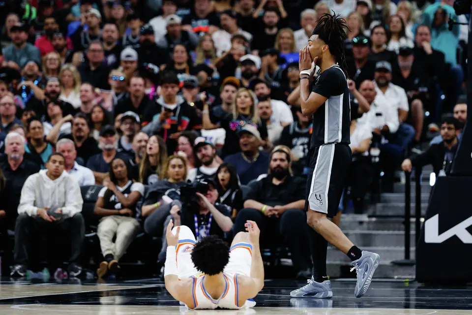 San Antonio Spurs guard Stephon Castle (5) reacts as Oklahoma City Thunder guard Jared McCain (3) falls to the ground during Game 6 of the Western Conference Finals at Frost Bank Center in San Antonio, Thursday, May 28, 2026.