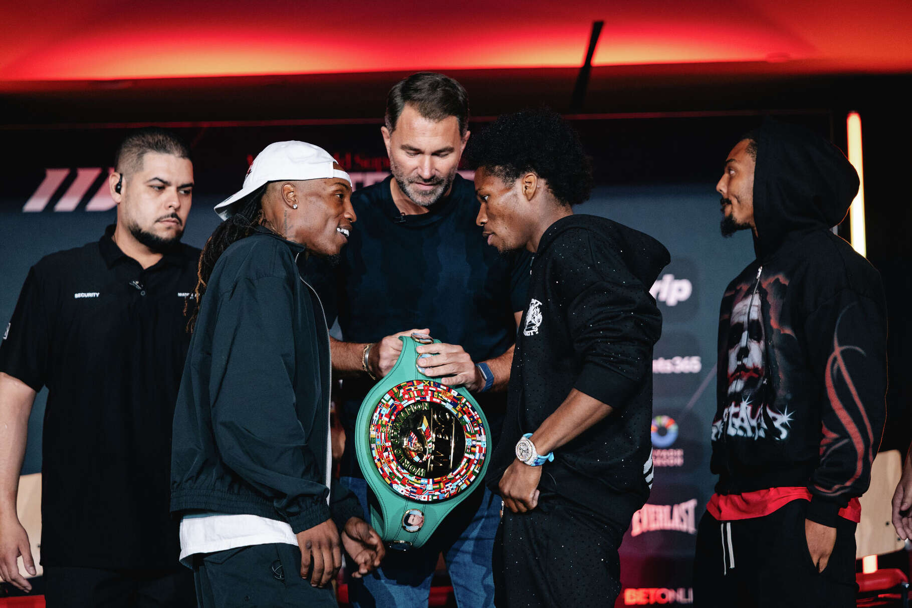 O'Shaquie Foster (left) and Raymond Ford (right) face off with promoter Eddie Hearn between them ahead of their fight for Foster's junior lightweight title Saturday, May 30 at Fertitta Center.