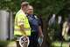 A member of the National Transportation Safety Board (NTSB) speaks to a member of the sheriff's department close to the scene of the collapsed apartment complex in the 400 block of east 9th Street in Oak Cliff in Dallas, Friday, May 29, 2026. Officials said at least three people died and several were injured after an explosion at an apartment building in north Oak Cliff on Thursday.