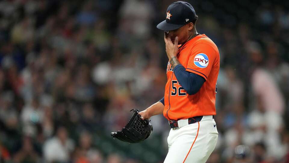 Houston Astros relief pitcher Bryan Abreu (52) reacts as he walked back to the dugout after Milwaukee Brewers' William Contreras flied out during the eighth inning of a baseball game, Friday, May 29, 2026, in Houston. (AP Photo/Karen Warren)