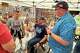 Iowa state Rep. Josh Turek, a Democratic candidate for U.S. Senate, talks with voters in Des Moines, Iowa, Saturday, May 23, 2026.