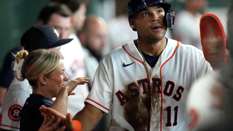 Houston Astros' Cam Smith, right, celebrates after his run scored on an RBI single by Jake Meyers during the second inning of a baseball game against the Milwaukee Brewers, Saturday, May 30, 2026, in Houston. (AP Photo/Karen Warren)