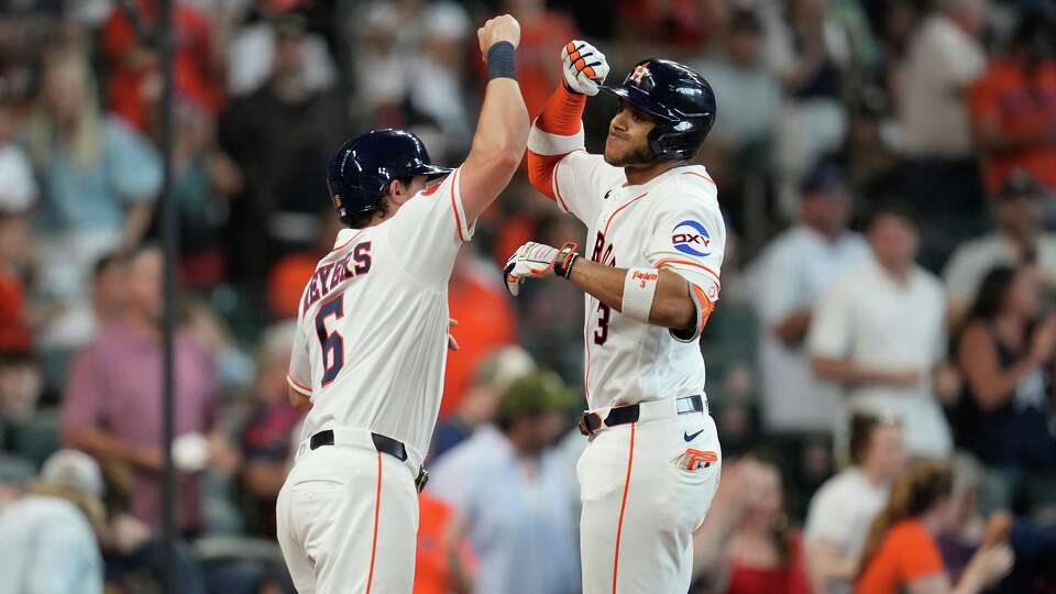 Houston Astros' Jeremy Pena, right, celebrates with Jake Meyers (6) after hitting a two-run home run off Milwaukee Brewers starting pitcher Brandon Sproat during the second inning of a baseball game, Saturday, May 30, 2026, in Houston. (AP Photo/Karen Warren)