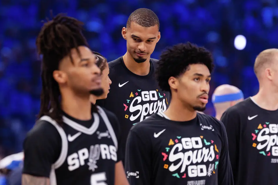 San Antonio Spurs center Victor Wembanyama (1) talks to San Antonio Spurs forward Carter Bryant (11) before Game 7 of the Western Conference finals at Paycom Center in Oklahoma City, on Saturday, May 30, 2026.