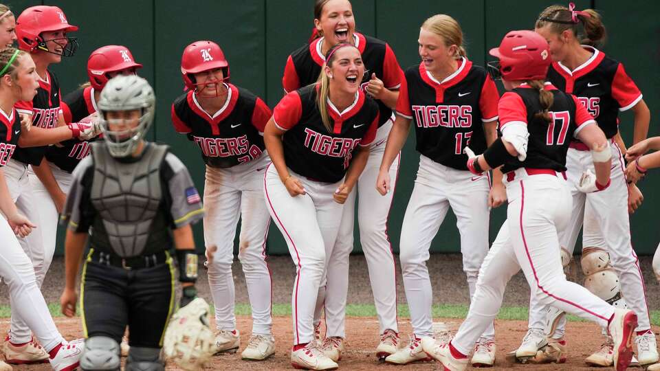 Katy players cheer as Abby Eldridge scores on her 2-run home run in the sixth inning of the Class 6A, Division II state Championship in Austin, Saturday, May 30, 2026.