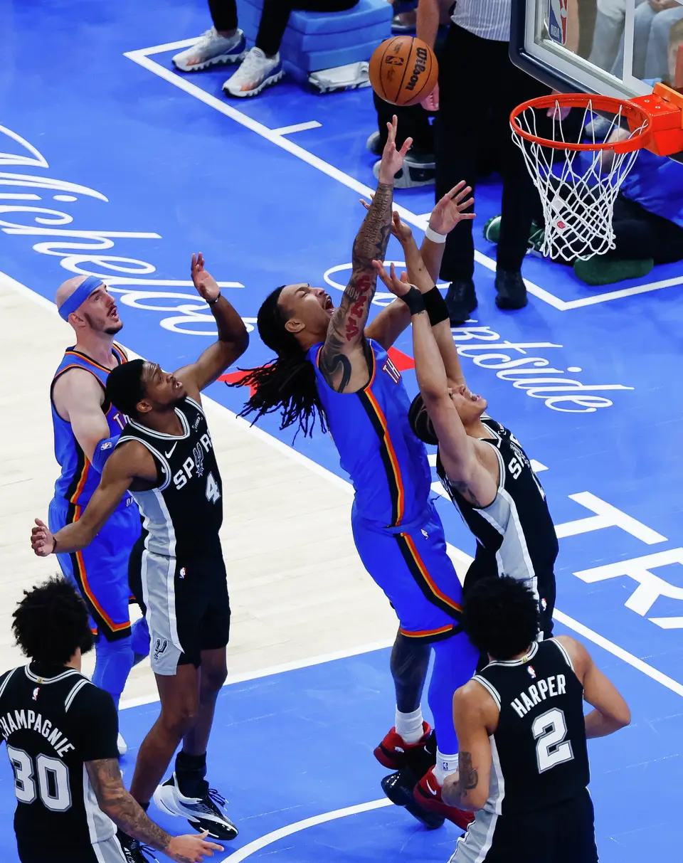 Oklahoma City Thunder forward Jaylin Williams (6) goes up for a shot while defended by San Antonio Spurs forward Carter Bryant (11) during Game 7 of the Western Conference finals at Paycom Center in Oklahoma City, on Saturday, May 30, 2026.