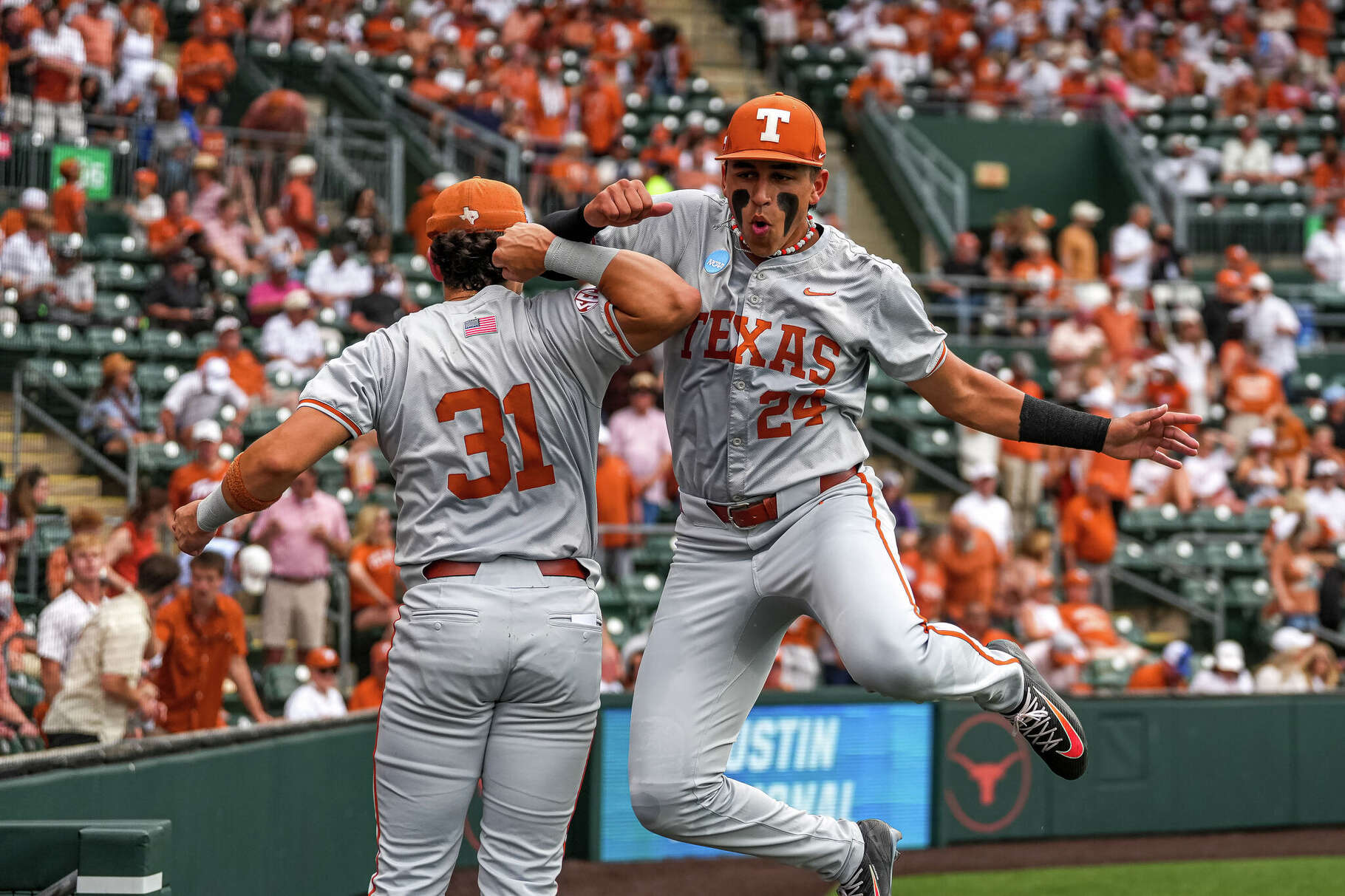 Texas Longhorns infielders Adrian Rodriguez (24) and Casey Borba (31) celebrate ahead of the NCAA Baseball Regional game against Tarleton State at UFCU Disch-Falk Field on Saturday, May 30, 2026 in Austin.