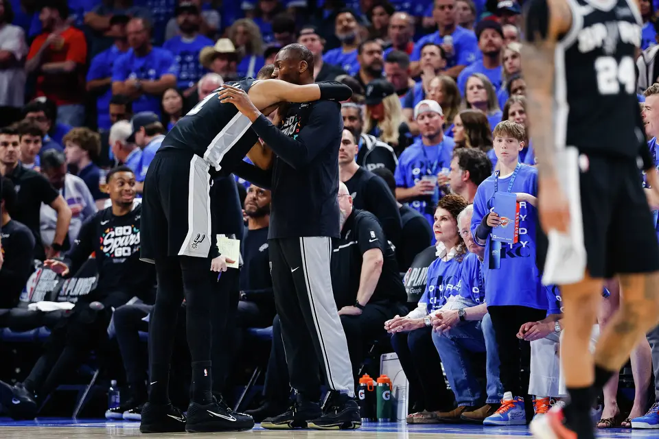 San Antonio Spurs center Victor Wembanyama (1) hugs San Antonio Spurs center Bismack Biyombo (18) during the third quarter of Game 7 of the Western Conference Finals at Paycom Center in Oklahoma City, Saturday, May 30, 2026.