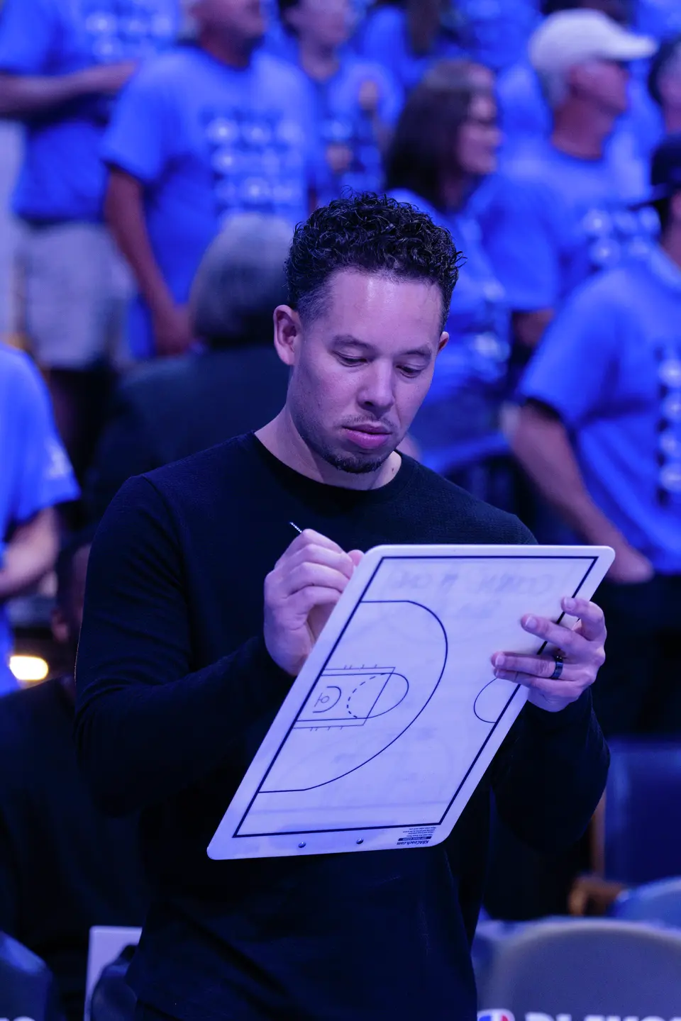 San Antonio Spurs head coach Mitch Johnson writes down notes during Game 7 of the Western Conference finals at Paycom Center in Oklahoma City, on Saturday, May 30, 2026.