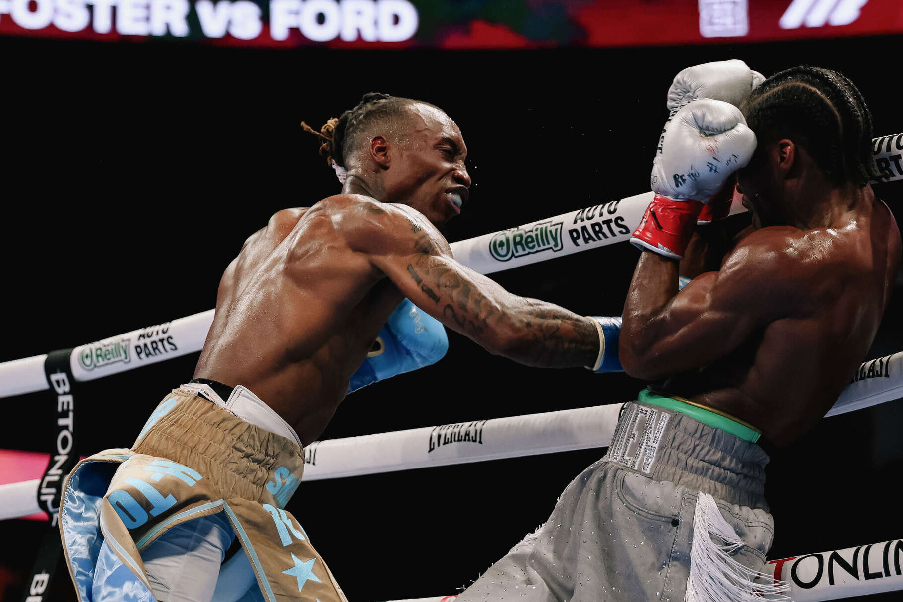 O’Shaquie Foster (left) lands a punch against Raymond Ford in their junior lightweight title fight on Saturday, May 30, 2026 at Fertitta Center in Houston.