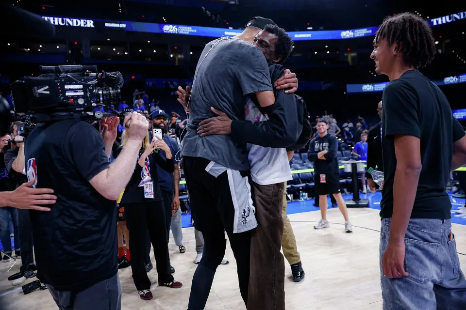 San Antonio Spurs center Victor Wembanyama (1) embraces his father Félix Wembanyama following the Spurs’ 111-103 victory over the Oklahoma City Thunder in Game 7 of the Western Conference Finals at Paycom Center in Oklahoma City, Saturday, May 30, 2026. The Spurs will face the New York Knicks in the NBA Finals.