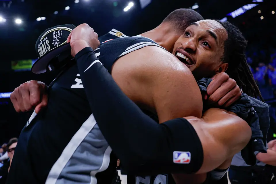 San Antonio Spurs center Victor Wembanyama (1) and guard Devin Vassell (24) embrace as they celebrate their Western Conference Finals win over the Oklahoma City Thunder at Paycom Center in Oklahoma City, Saturday, May 30, 2026. The Spurs defeated the Thunder 111-103 in Game 7 to advance to the NBA Finals against the New York Knicks.