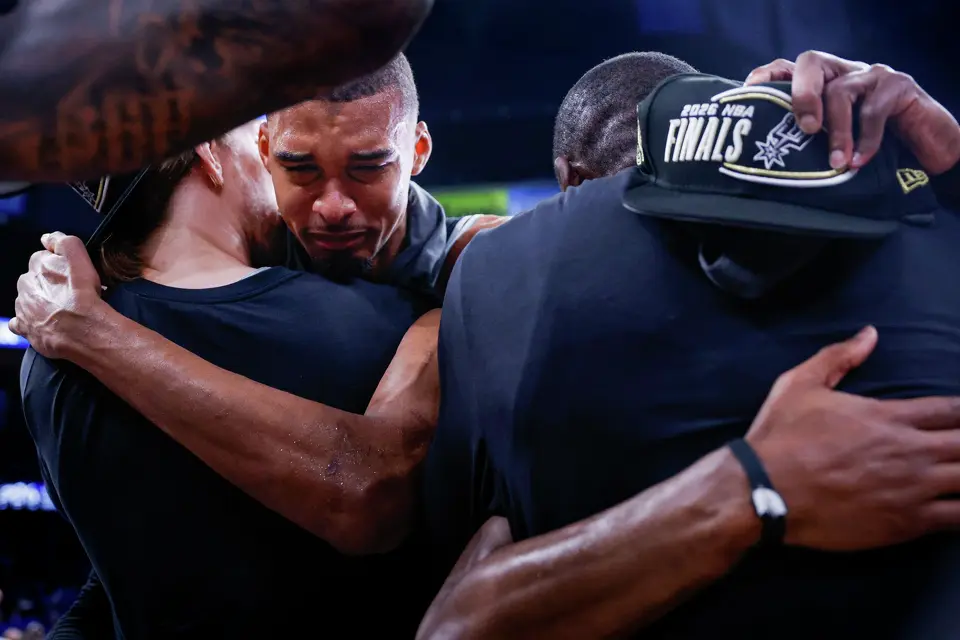 San Antonio Spurs center Victor Wembanyama (1) embraces his teammates as they celebrate their victory over the Oklahoma City Thunder in the Western Conference Finals at Paycom Center in Oklahoma City, Saturday, May 30, 2026. The Spurs defeated the Thunder 111-103 in Game 7 to advance to the NBA Finals against the New York Knicks.