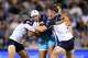FILE - Christian Lealiifano of Moana Pasifika is tackled by Billy Pollard of the Brumbies during the Super Rugby Pacific Round 5 match between the ACT Brumbies and Moana Pasifika in Canberra, Friday, March 22, 2024. (Lukas Coch/AAP Image via AP, File)