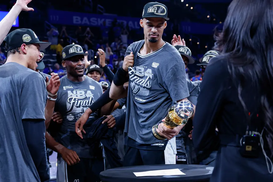 San Antonio Spurs center Victor Wembanyama holds his new Earvin “Magic” Johnson Trophy after the Spurs defeated the Oklahoma City Thunder in the Western Conference finals on Saturday, May 30, 2026, at Paycom Center in Oklahoma City. Wembanyama was named Western Conference finals MVP as San Antonio advanced to the NBA Finals against the New York Knicks.